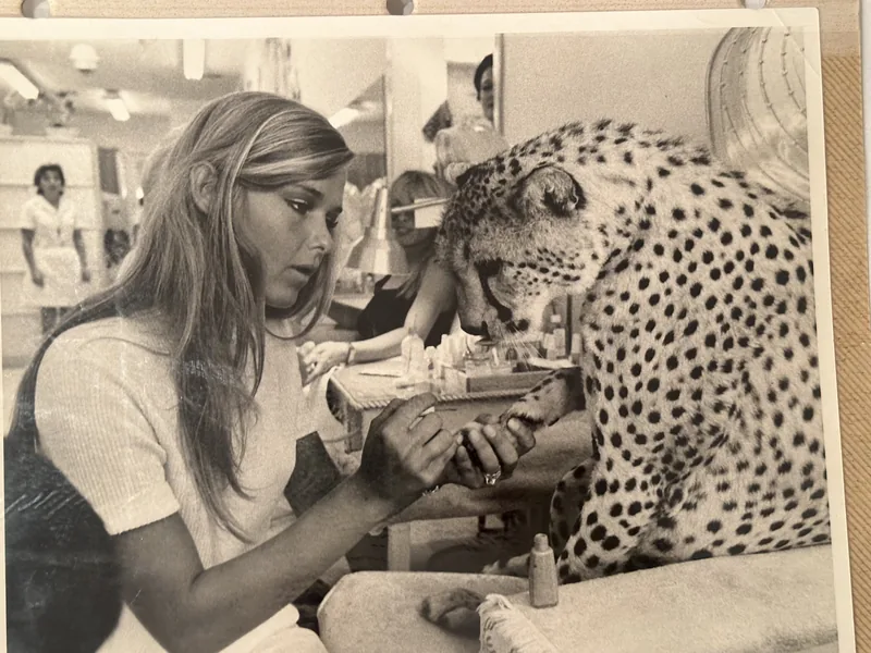 Archival photo of a woman with a cheetah