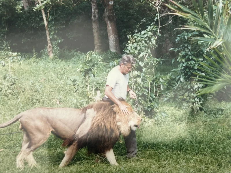Archival photo of a trainer with a lion